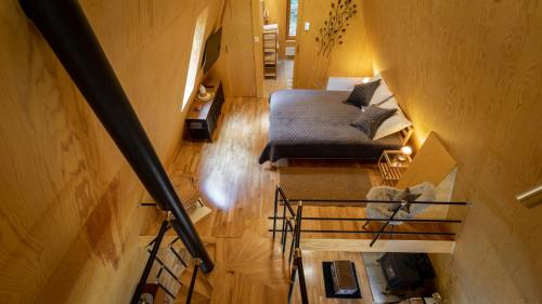 Katil atau katil-katil dalam bilik di Forest House Stella - A frame cabin