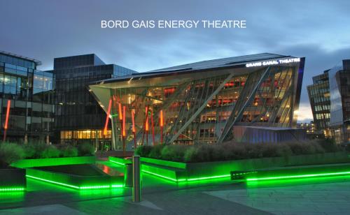 a glass building with green lights in front of it at Fitzwilliam Townhouse in Dublin