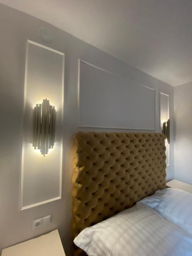 Ένα ή περισσότερα κρεβάτια σε δωμάτιο στο Apartamenty i pokoje nowomiejska 119