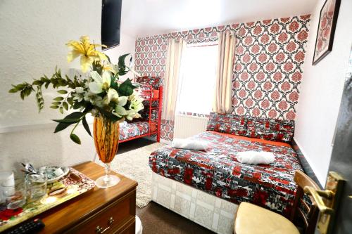 Ένα ή περισσότερα κρεβάτια σε δωμάτιο στο Blackpool Central Hotel