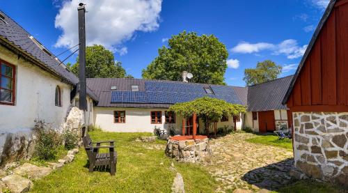 a house with solar panels on the roof at Tobishirdgård in Simrishamn