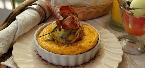 a plate of food on a table at Headlands Inn Bed and Breakfast in Mendocino
