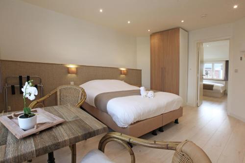 Ένα ή περισσότερα κρεβάτια σε δωμάτιο στο Hotel Cecil