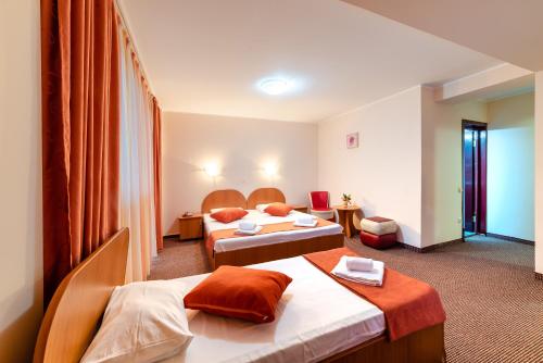 Tempat tidur dalam kamar di Hotel Giulia