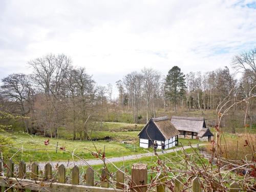 an old house in the middle of a field at 2 person holiday home in Aakirkeby-By Traum in Vester Sømarken