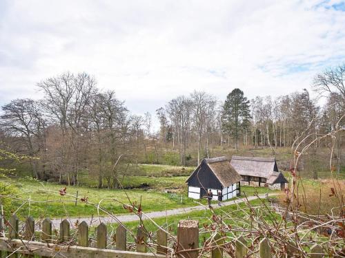 an old house in the middle of a field at 2 person holiday home in Aakirkeby-By Traum in Vester Sømarken