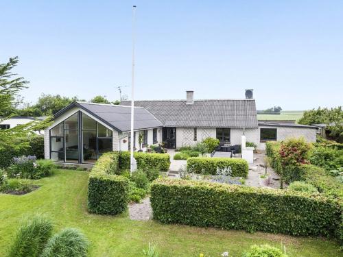 a house with a garden in front of it at 8 person holiday home in Vesløs-By Traum in Vesløs