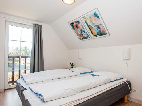 Postel nebo postele na pokoji v ubytování 8 person holiday home in Rømø-By Traum