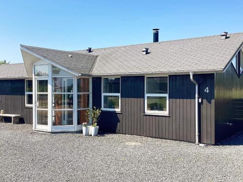 a building with a lot of windows on it at 6 person holiday home in Ansager-By Traum in Ansager