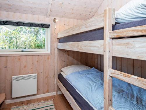 En eller flere senge i et værelse på 6 person holiday home in Hemmet-By Traum