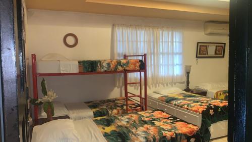 Postel nebo postele na pokoji v ubytování Hostal familiar Villa Nome
