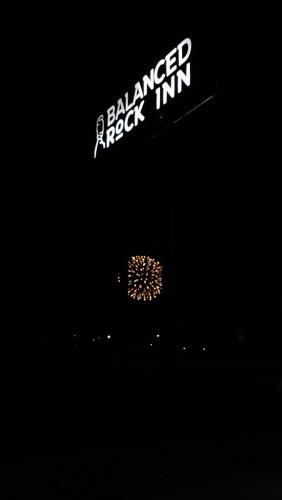 a ballaged rockin sign in the dark at Balanced Rock Inn in Fruita