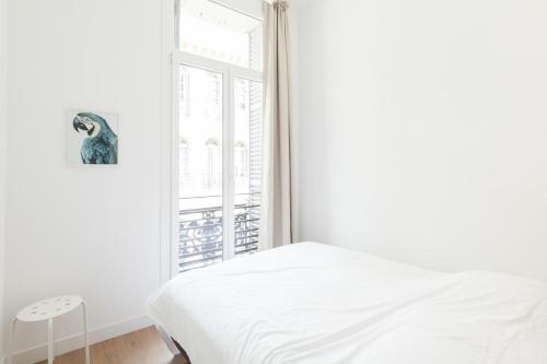 Ліжко або ліжка в номері Palmeraie II - Magnifique au Coeur de Marseille