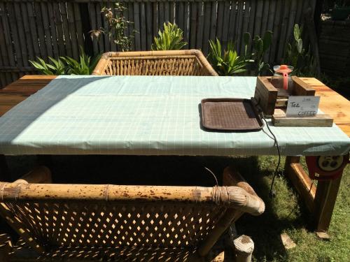 a picnic table with a mattress on top of it at Old Village Gili Air in Gili Air