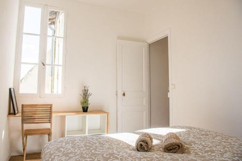 Ліжко або ліжка в номері Le Repaire - 2 chambres avec balcon