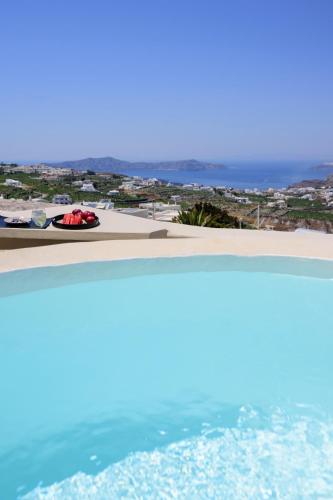 a view of the beach and the ocean at Diva Santorini Luxury Villa in Pirgos
