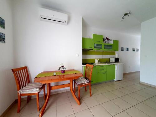 A kitchen or kitchenette at Apartments Tri sestrice