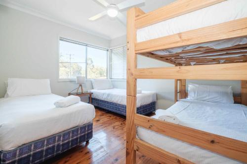 a bedroom with two bunk beds and a window at Yarramie in Mount View