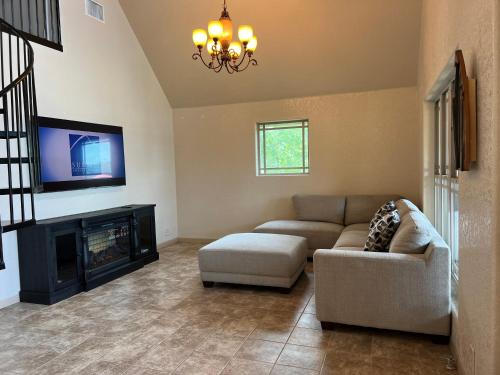 a living room with a couch and a fireplace at Lakefront Oasis with Private Boat Dock on Lake Palestine in Coffee City