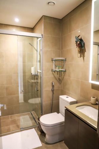 a bathroom with a toilet and a shower and a sink at STAY BY LATINEM Luxury 1BR Holiday Home CV A2605 near to Burj Khalifa in Dubai