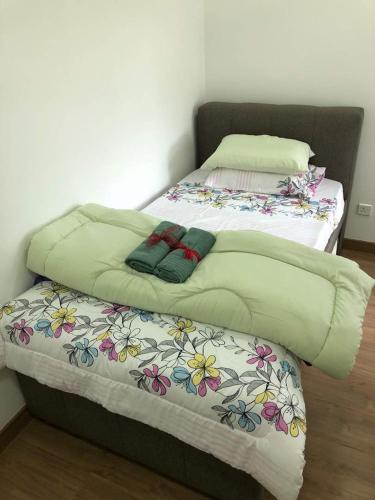 Ένα ή περισσότερα κρεβάτια σε δωμάτιο στο Condo in Cyberjaya near MMU University