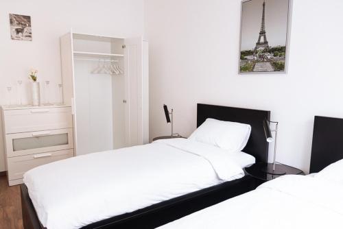 A bed or beds in a room at A 210, apartments in the heart of Budapest