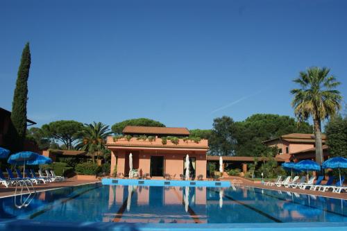 a swimming pool in front of a resort at Hotel Residence Villa San Giovanni in Portoferraio