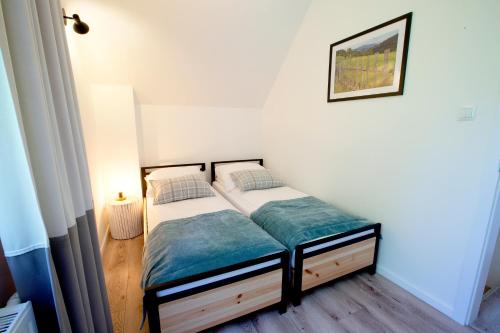 Кровать или кровати в номере Beskid Ski Villa