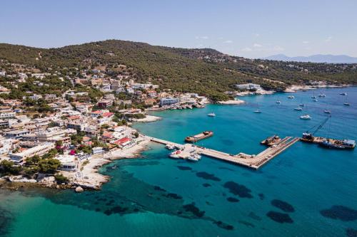 an aerial view of a harbor with boats in the water at Aphaia Villa & Residences Aegina in Agia Marina Aegina