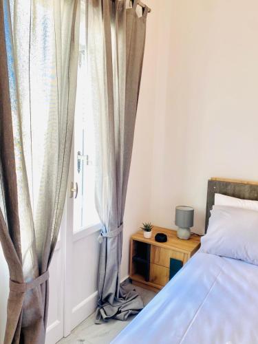 Postel nebo postele na pokoji v ubytování Nostos II