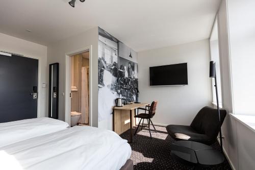 TV a/nebo společenská místnost v ubytování Hotel Garni