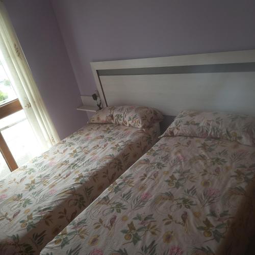 LUARCAPLAYA APARTAMENTO Plazas de garaje incluidasにあるベッド