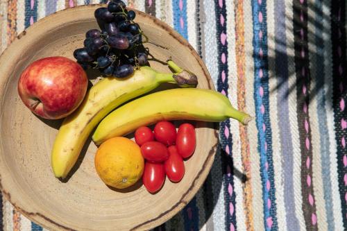 a bowl of fruits and vegetables on a table at Gateway Suites in Rethymno Town