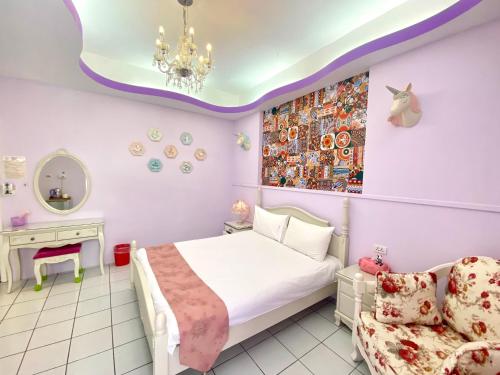 Una cama o camas en una habitación de Hualien Dawan B&B