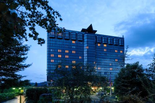 a tall building with a star on the top of it at Mercure Hotel Koblenz in Koblenz