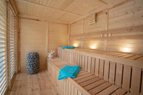 a wooden sauna with wooden floors and wooden walls at Vulkan Villa in Mendig