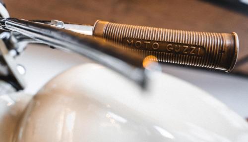 a motoroto coil sitting on top of a motorcycle at Pri Karlu Rooms & More in Maribor
