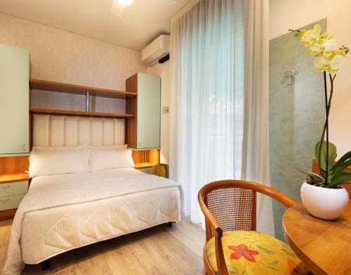 Postel nebo postele na pokoji v ubytování Hotel Castellucci