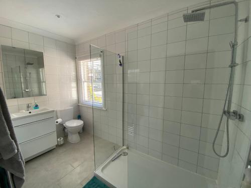 a bathroom with a shower and a sink and a toilet at Number 29, Westgate-on-Sea in Westgate-on-Sea