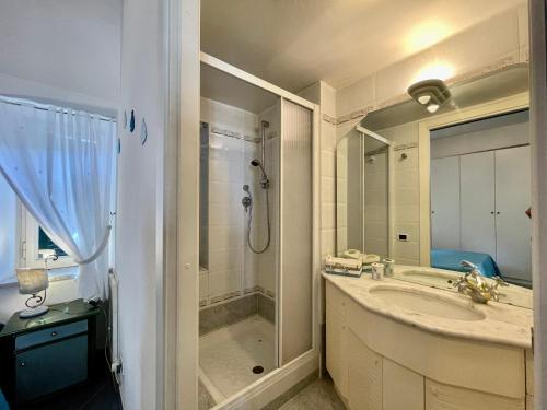 a bathroom with a sink and a shower and a tub at LA CASETTA NEL BORGO - San Felice Circeo in San Felice Circeo
