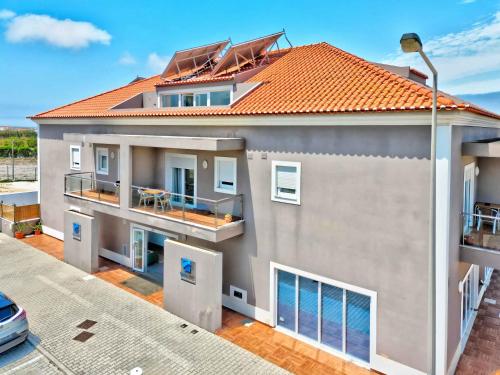 an overhead view of a house with an orange roof at Hotel Baleal Spot in Baleal