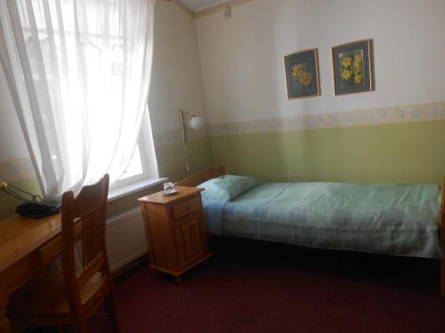 Кровать или кровати в номере Poska Villa Guesthouse