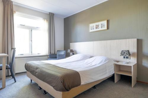Postel nebo postele na pokoji v ubytování Hotel Millingen