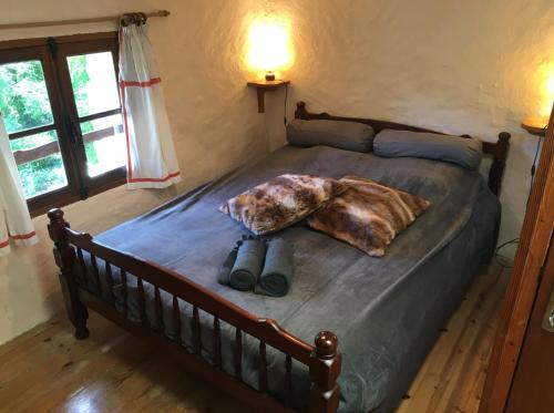 a bed with two binoculars on it in a bedroom at Gîte de la Bastide - Cabania Pays Cathare in Camps-sur-lʼAgly