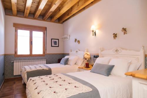Säng eller sängar i ett rum på Casa rural el gato encantado