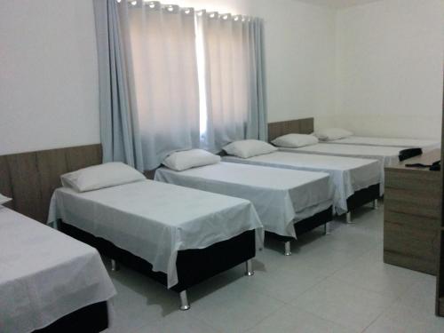 Katil atau katil-katil dalam bilik di Conquista Palace Hotel