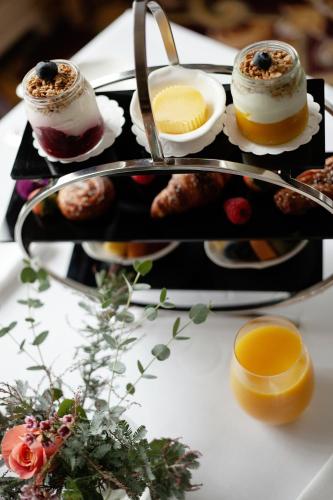 a plate of food with desserts on a table at The K Club in Straffan