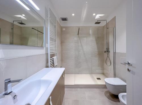 a bathroom with a sink and a toilet and a shower at Appartamenti in Villa del '900 (A) in Varazze