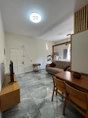 a living room with a couch and a table at Diamond Apartment In Haifa in Haifa