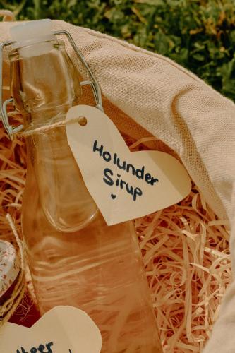 a bottle of honey with a tag on it at Almhaus Kochjosel in Garanas